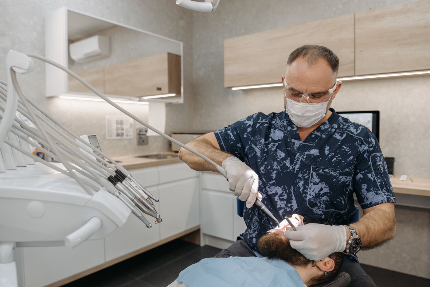 Dentist treating a patient in a modern clinic